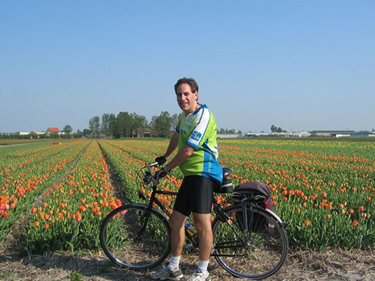 a person standing in front of a bicycle