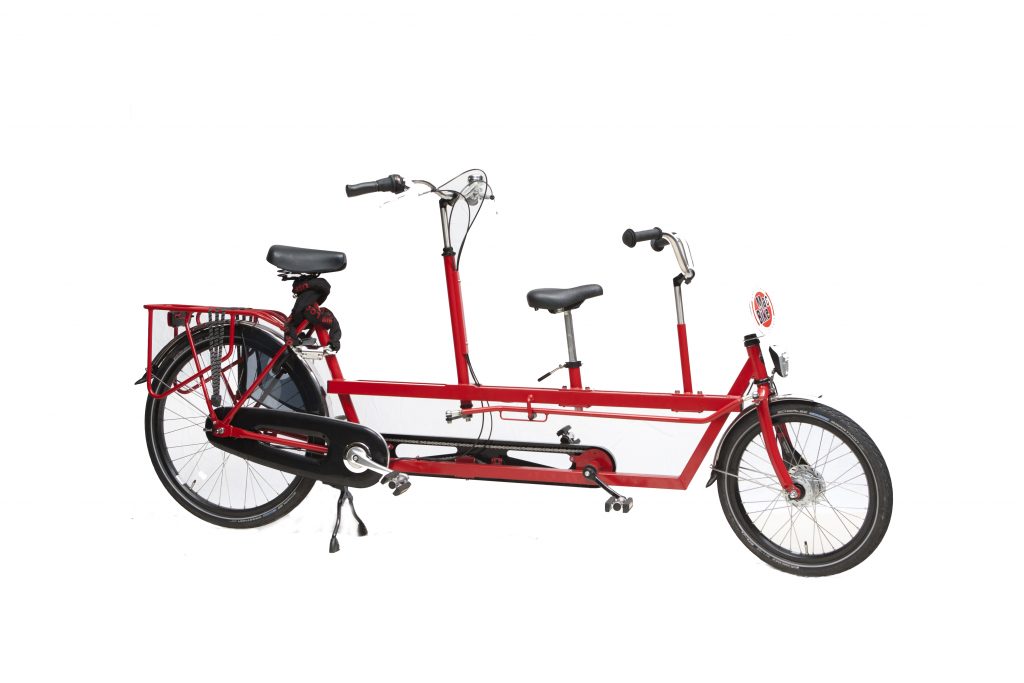 a bicycle leaning against a wall