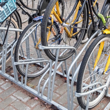 a bicycle parked on a sidewalk